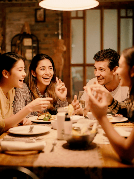 An hispanic family has a lively discussion at the dinner table.